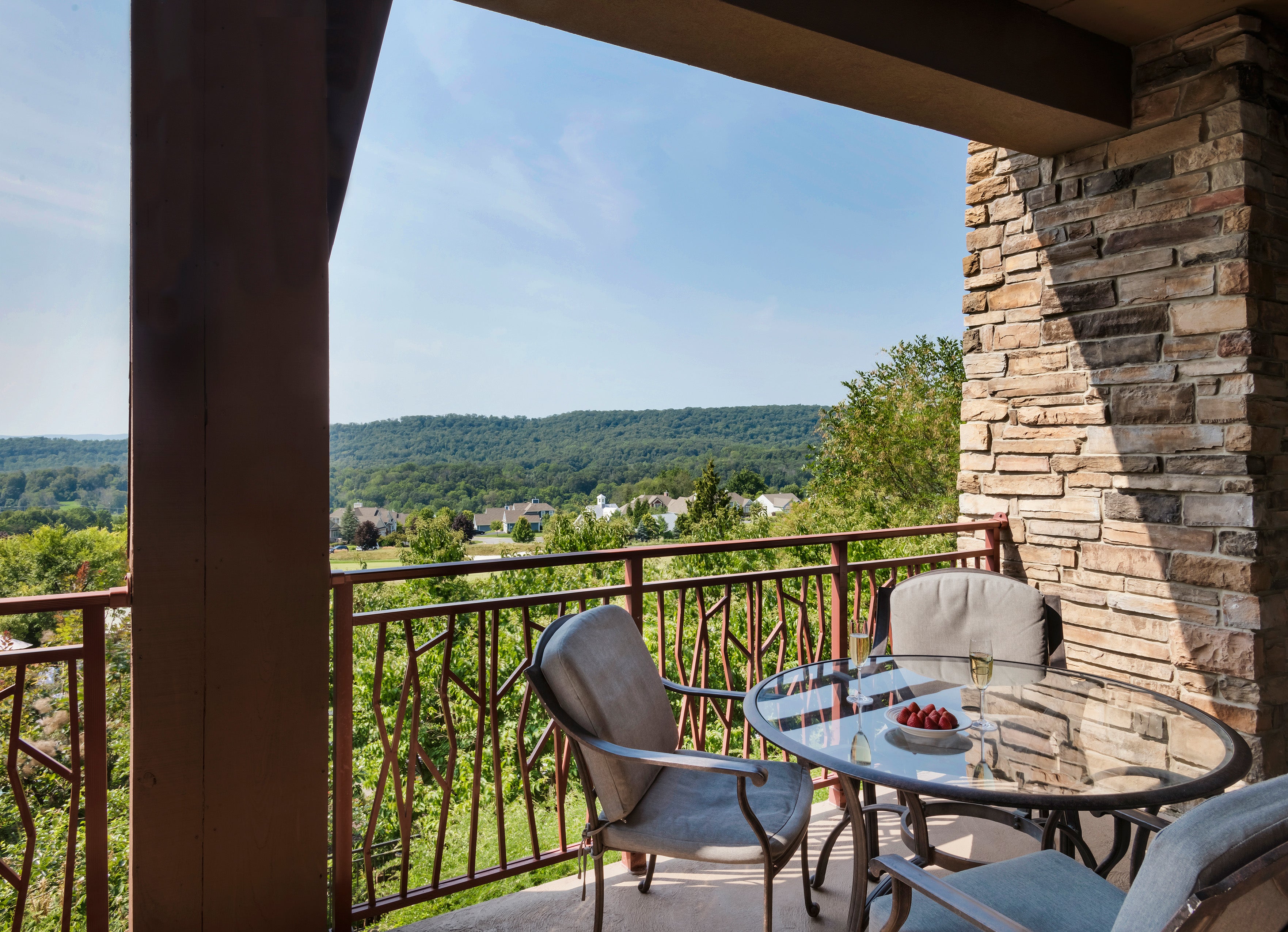 Balcony overlooking golf course and mountains