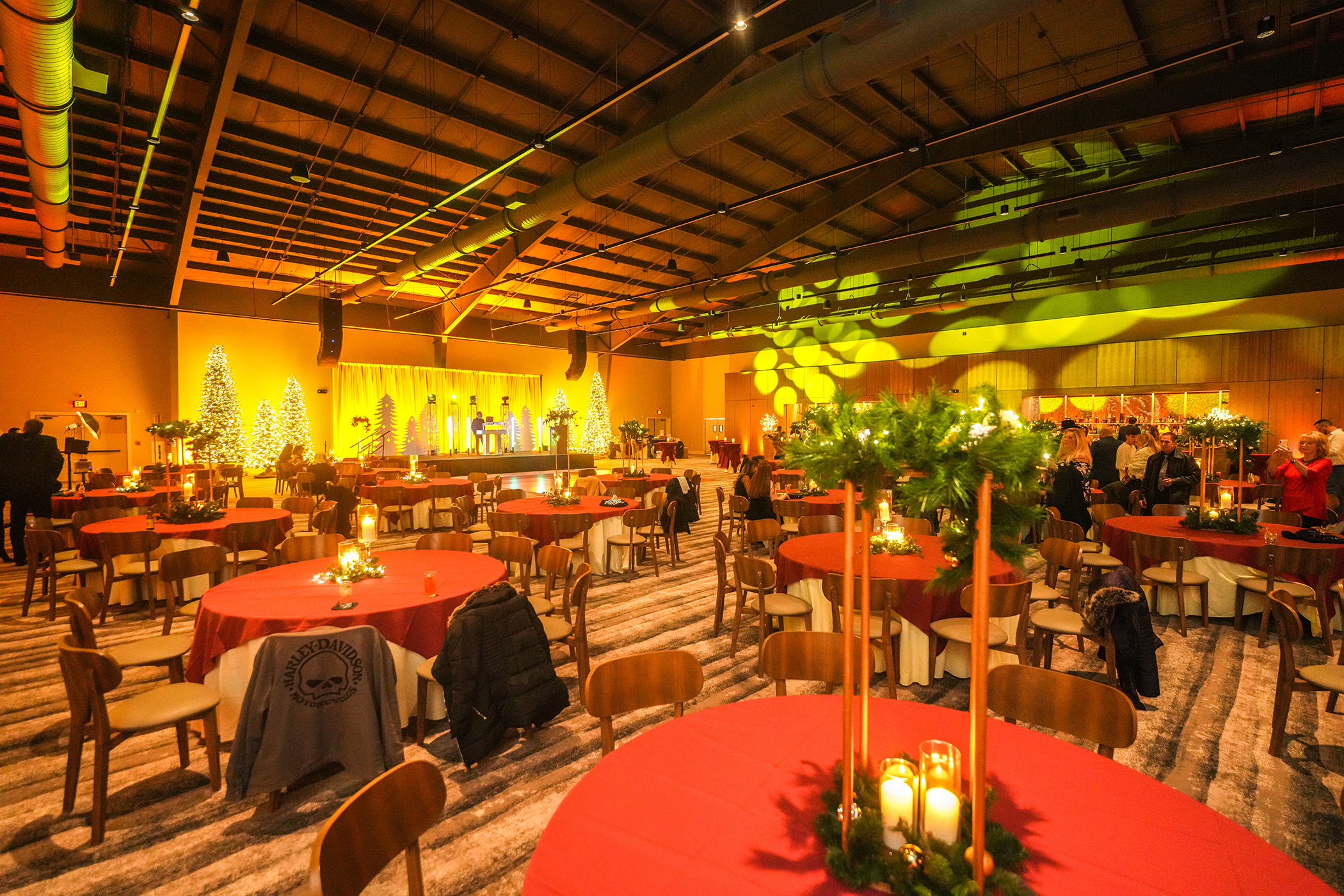 Round tables with red tablecloths set up in Canyon Ballroom.