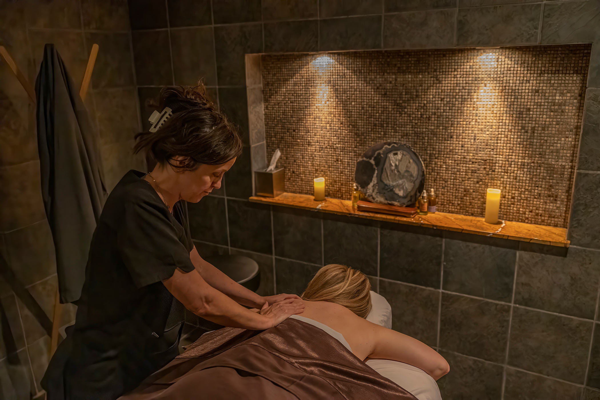 Woman receiving a massage at Elements Spa.