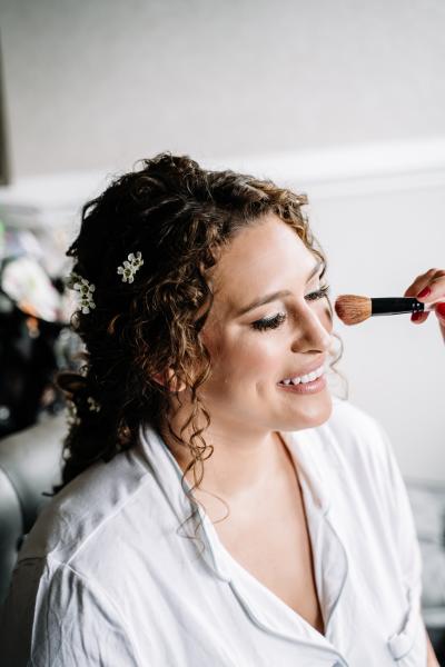 Bride getting her make up done for wedding day