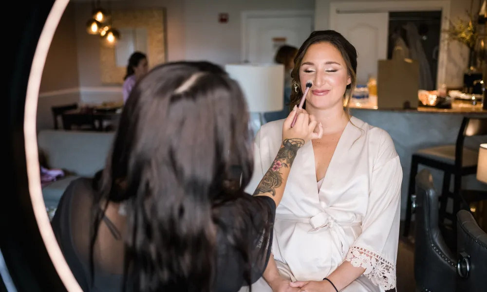 Bride getting her makeup done at Crystal Springs Resort