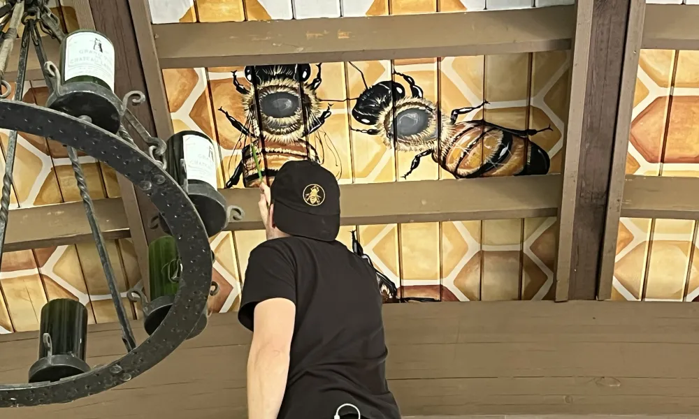 Matt Wiley painting mural