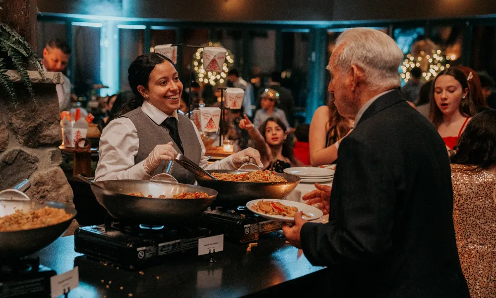 Man getting food from buffet in Grand Rotunda. 