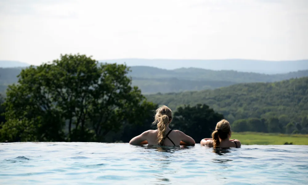 Women looking out at horizon in Vista 180 pool.
