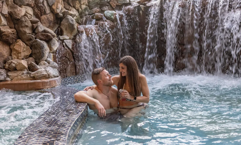 Couple in hot tub at Minerals Hotel