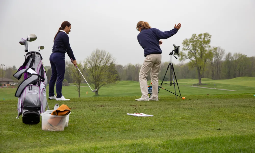 Girl taking golf lessons at Crystal Springs Resort