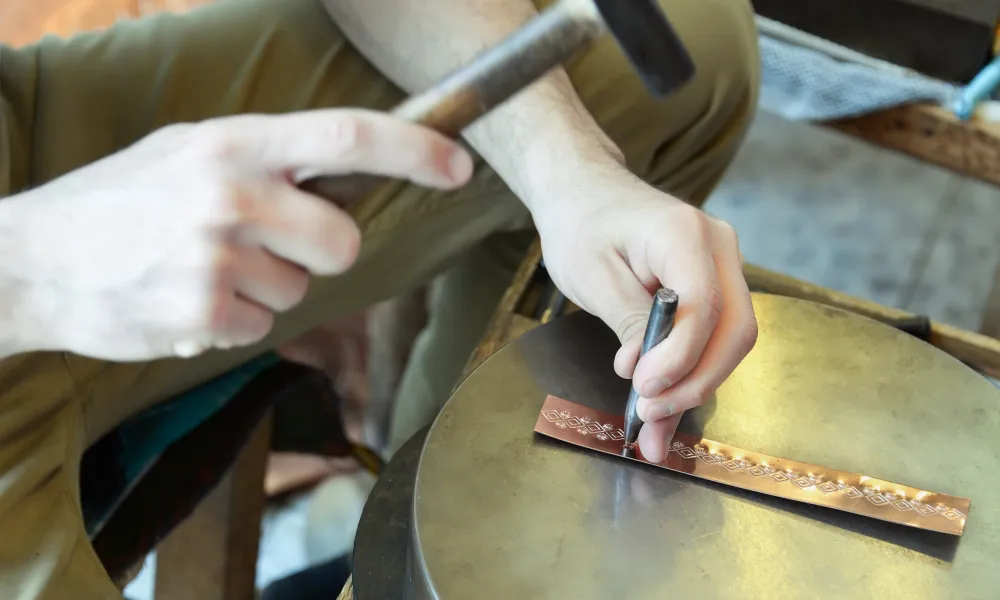 Person metal stamping.