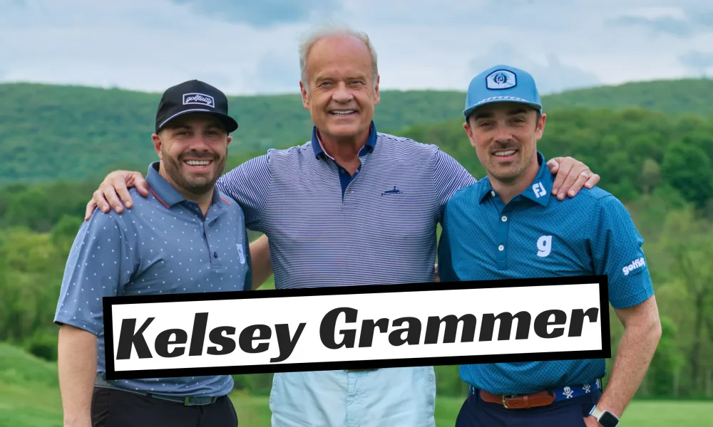 Kelsey Grammer standing with fans.