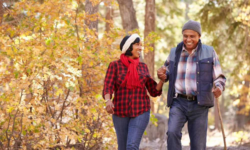 Couple hiking in woods on getaway.