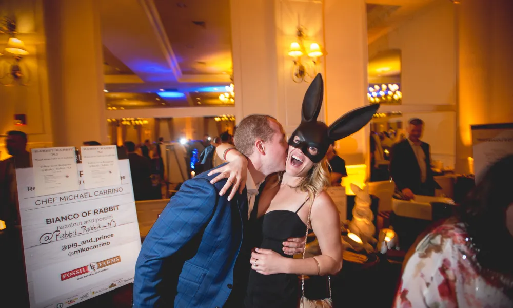 Couple on NYE with girl wearing rabbit mask