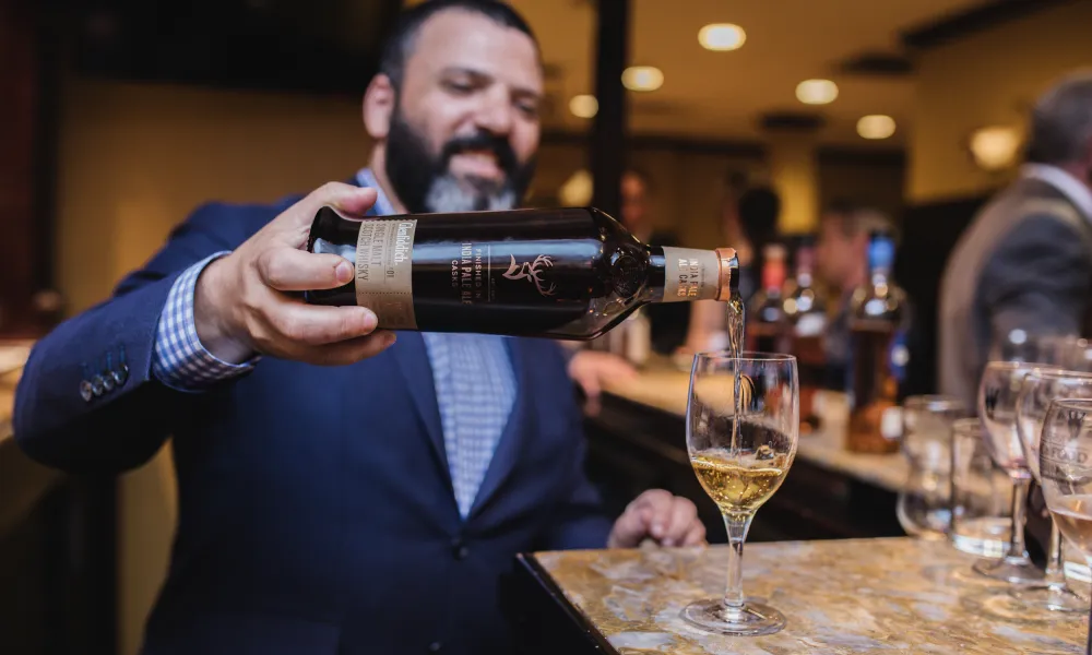 Pouring of white wine at NJ Wine and Food Festival 