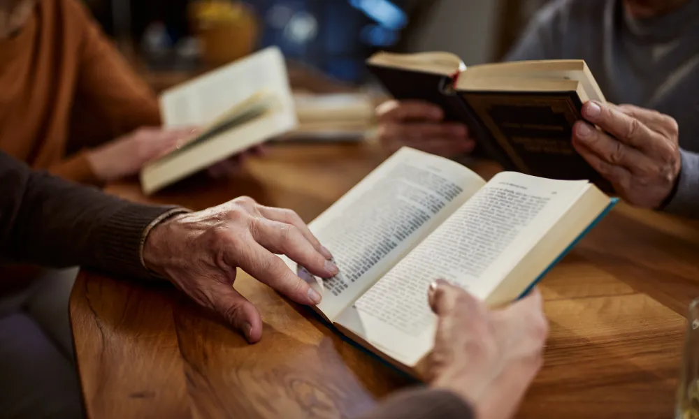 Person holding a book.