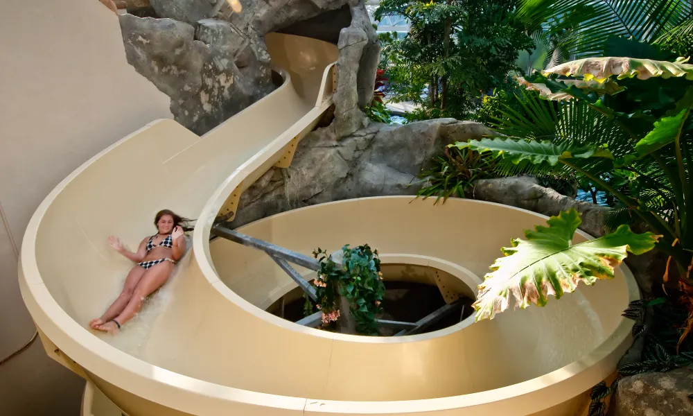 Girl going down Biosphere water slide at Crystal Springs Resort in NJ