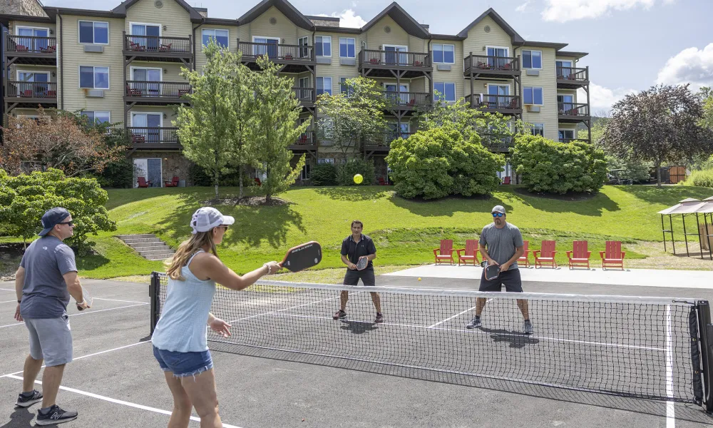 Family playing pickleball.