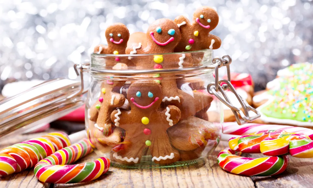 Decorated gingerbread cookes in a jar.