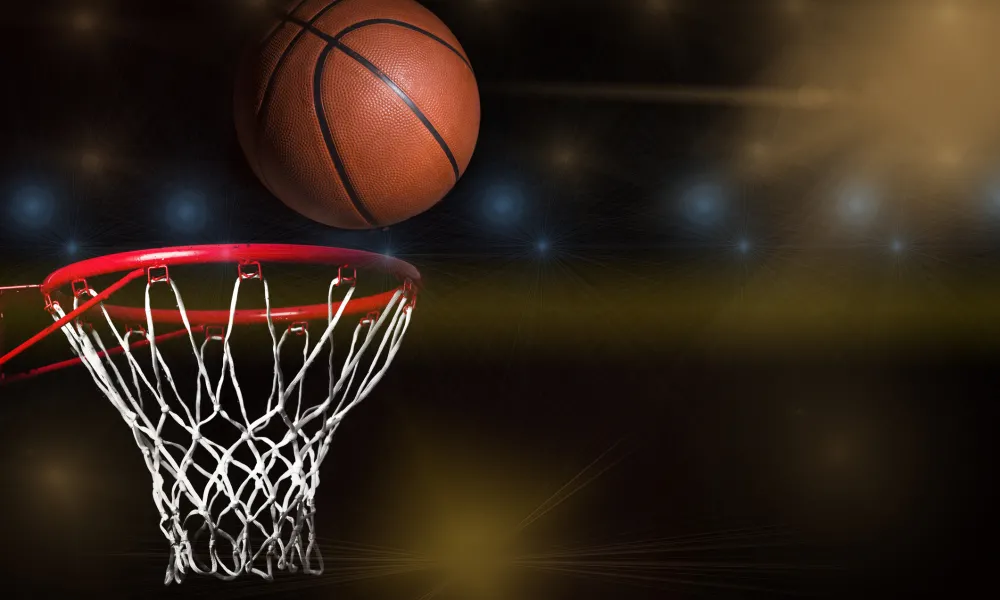 Basketball going into hoop.