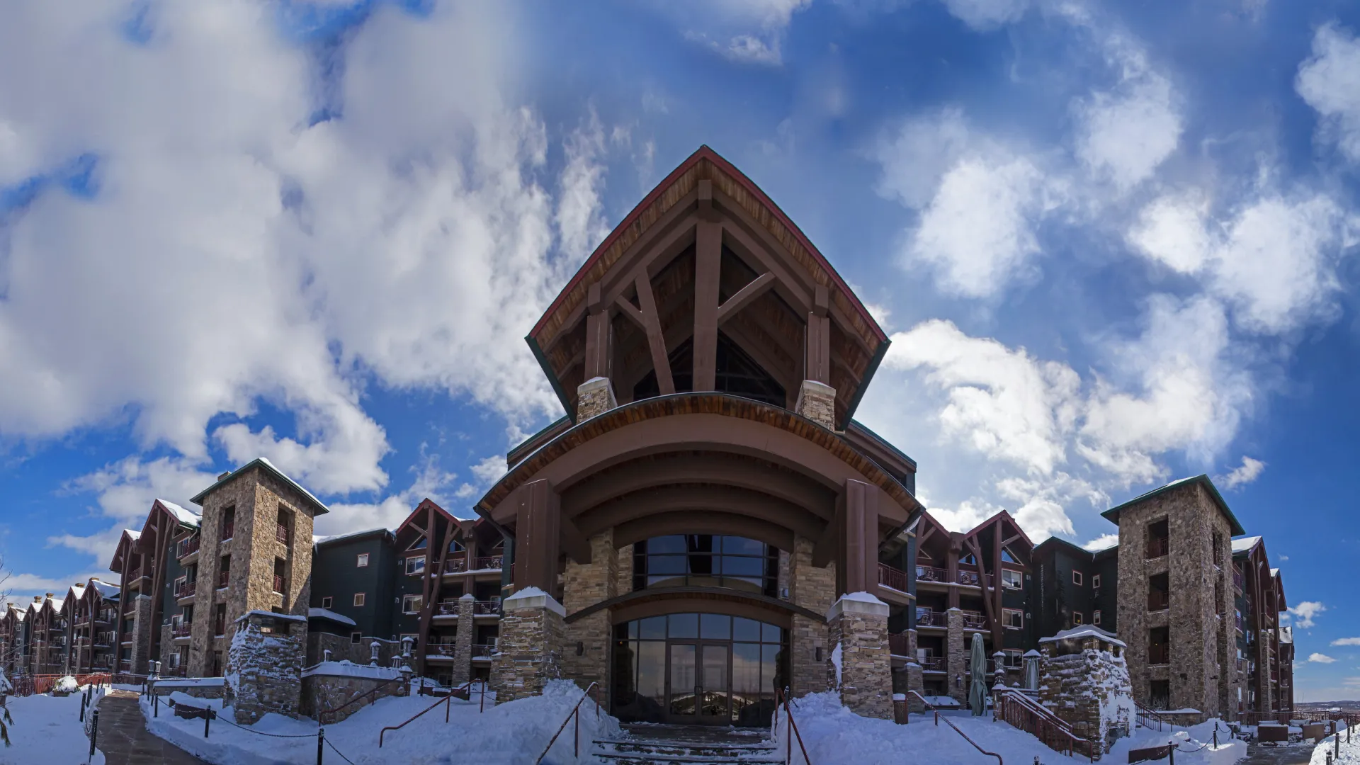 Grand Cascades Lodge in Winter with Blue Sky.