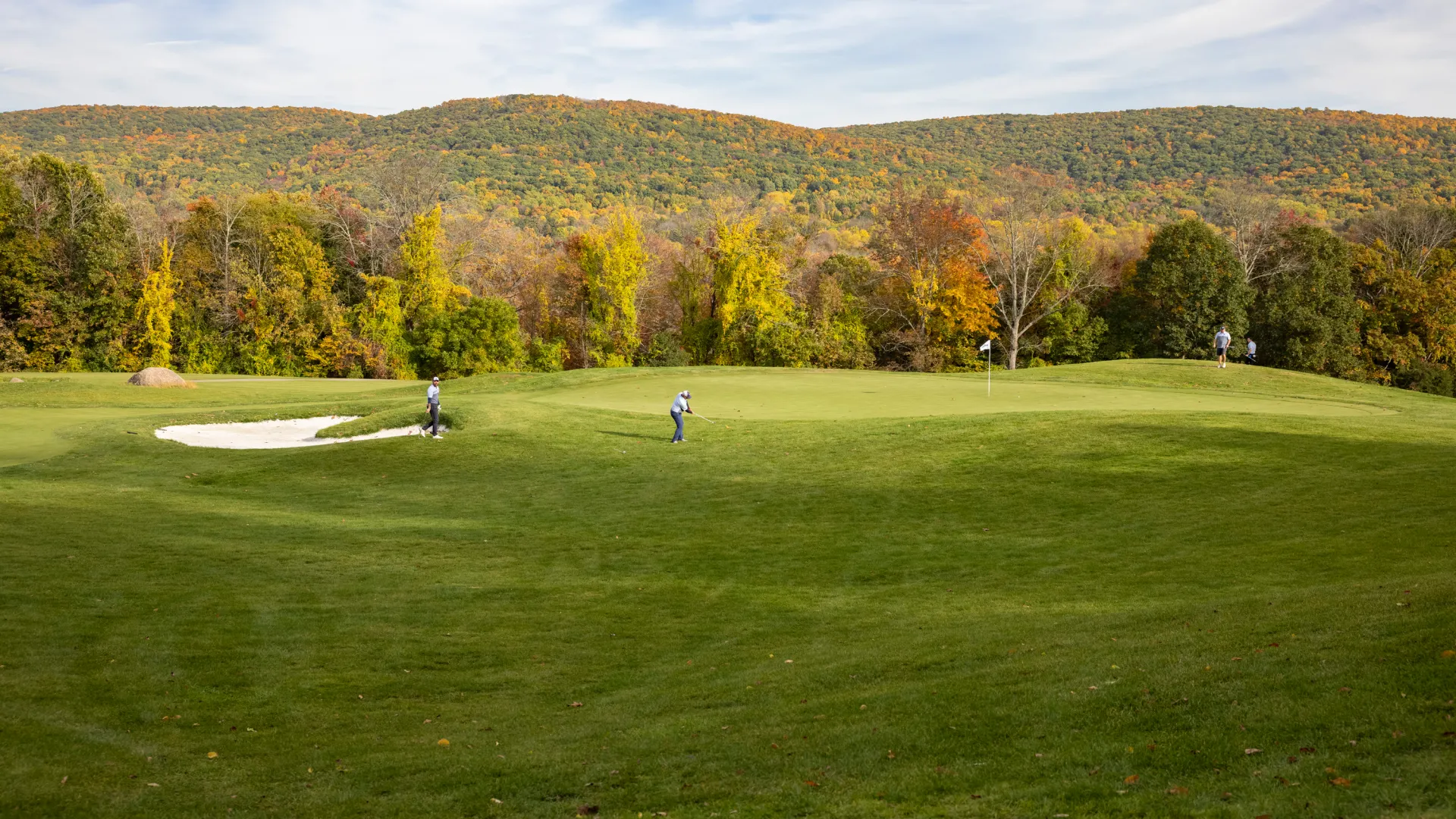 Two golfers on Wild Turkey during fall.