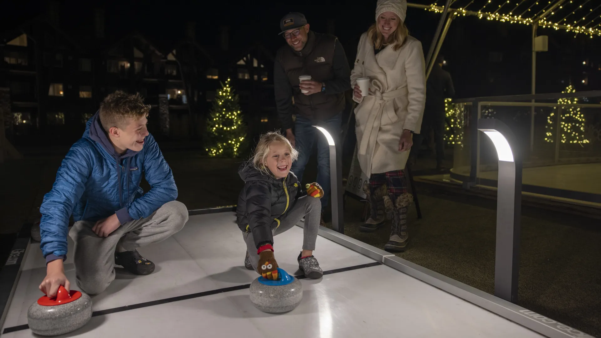 Two children curling. 