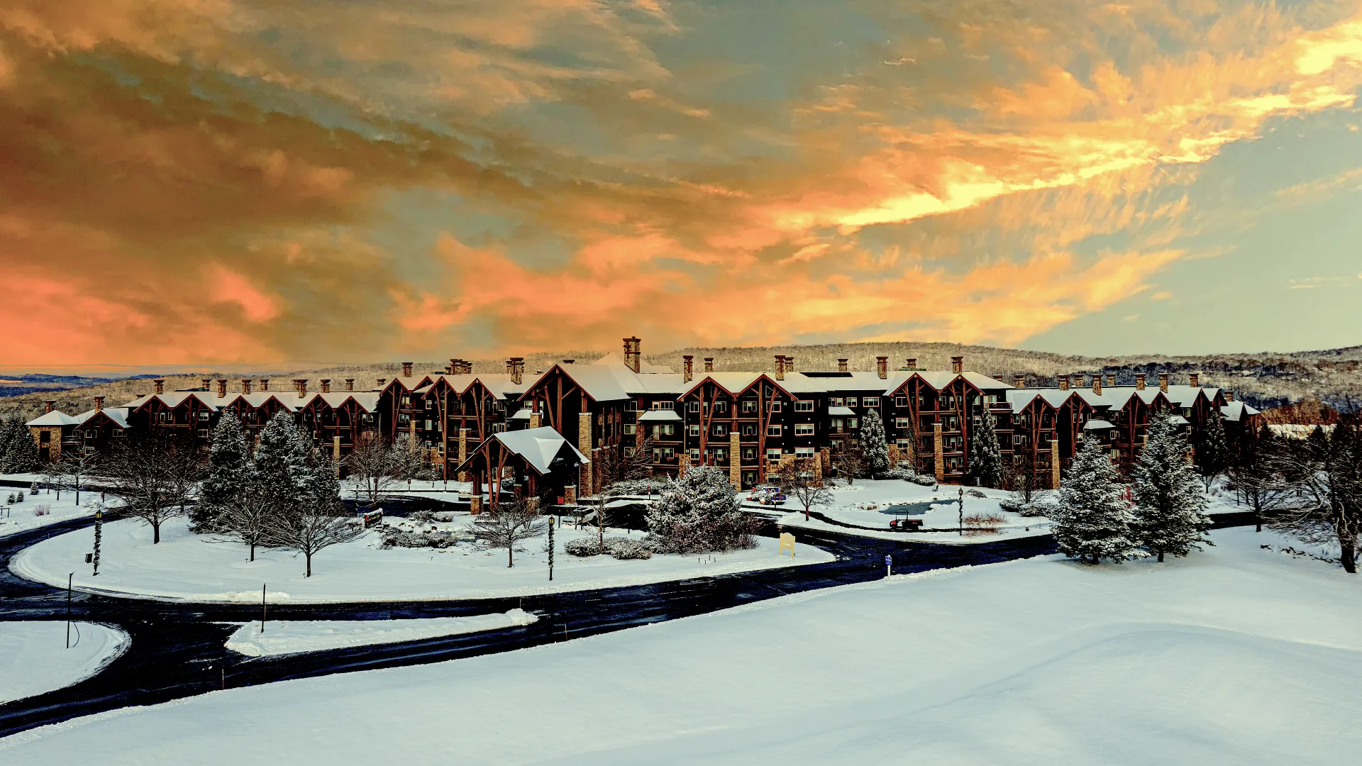 Grand Cascades Lodge exterior during winter with snow.