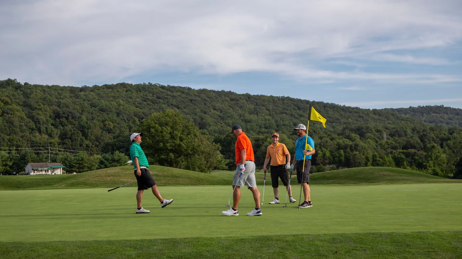 Foursome of guys on the green at Black Bear Golf Club