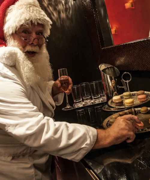 Santa eating macaroons at Reflections Spa at Grand Cascades Lodge