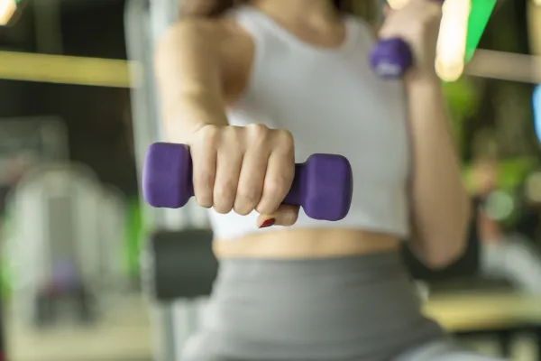 Woman holding light weight.