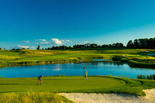 Two golfers standing on Ballyowen Golf Course. 