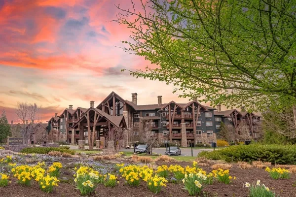 Grand Cascades Lodge exterior during spring with sunset.