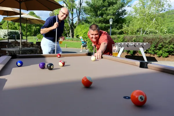 Men playing game of pool