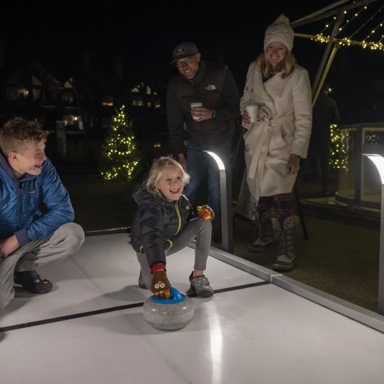 Two children curling. 