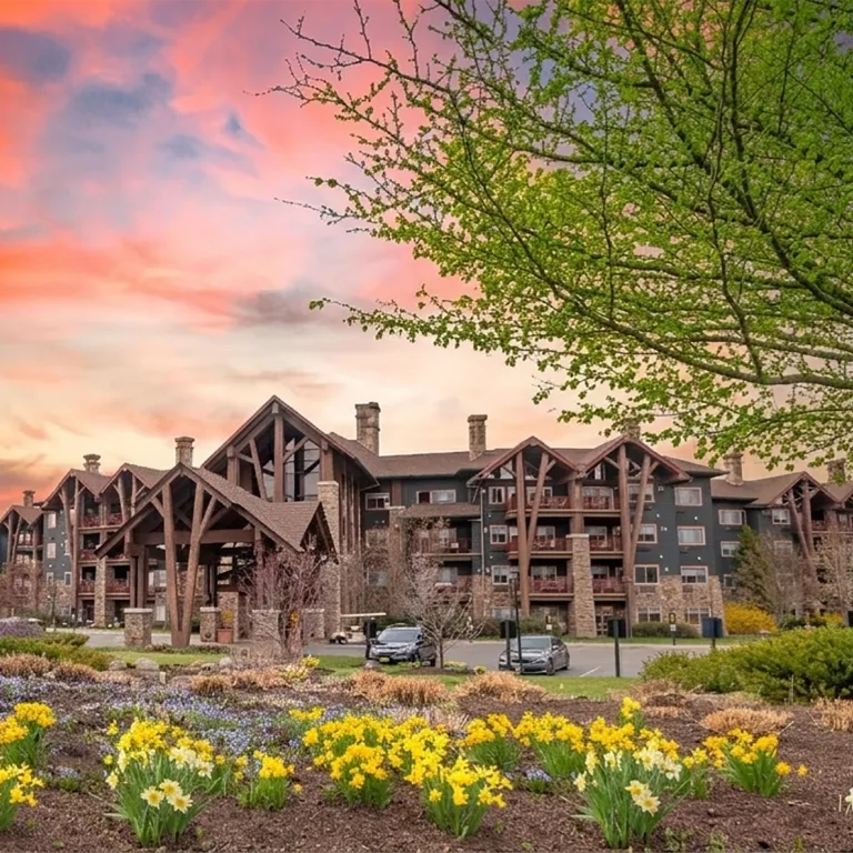 Grand Cascades Lodge exterior during spring with sunset.