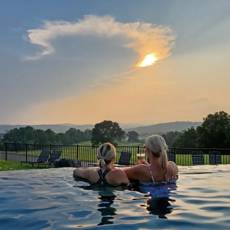 Girlfriends enjoying drinks at Vista 180 pool.