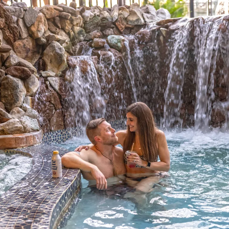 Couple enjoying drinks in the jacuzzi