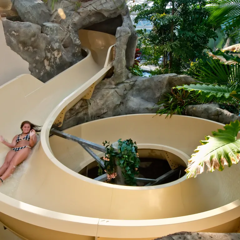 Girl going down Biosphere water slide at Crystal Springs Resort in NJ