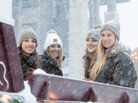 Girlfriends taking a ride in the carriage. 