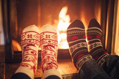 Winter socks in front of cozy fire.