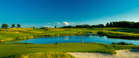 Two golfers standing on Ballyowen Golf Course. 