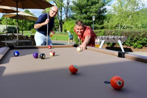 Men playing game of pool