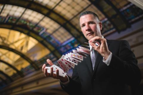 John Graham shuffling deck of cards.