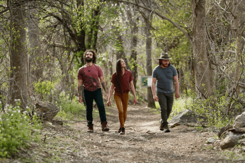 Three people hiking at Wild Turkey Nature Trail