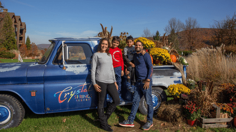 Fall family at the blue Crystal Springs Resort truck