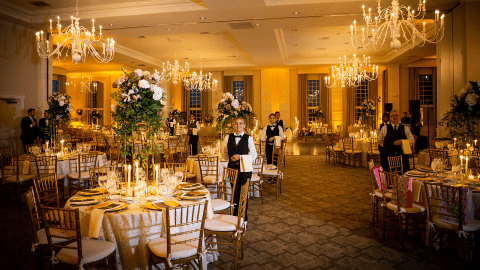 Banquet servers during a wedding in the Emerald Ballroom