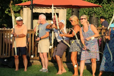 Adults enjoying a teambuilding activity with Archery Tag
