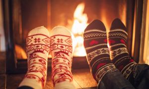 Winter socks in front of cozy fire.