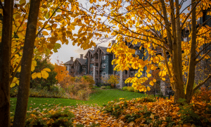 Grand Cascades Lodge through autumn trees