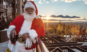 Santa in front of scenic view at Grand Cascades Lodge at Crystal Springs Resort NJ