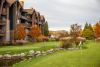 Grand Cascades Lodge in Fall with mountains in back.