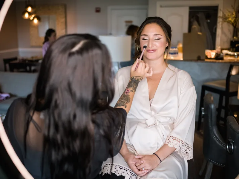 Bride getting her makeup done at Crystal Springs Resort