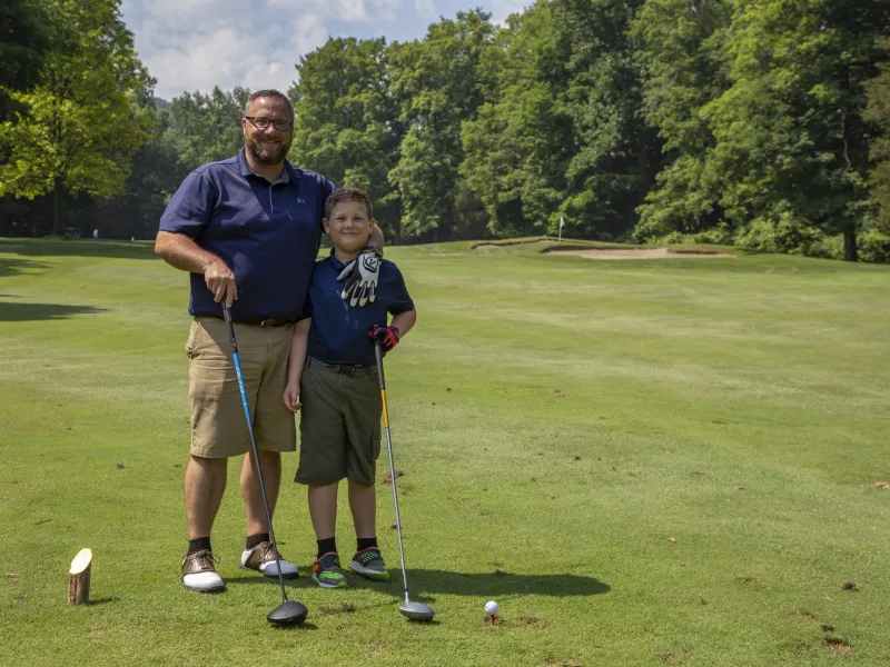 Father son duo playing golf together on Minerals Golf Course 